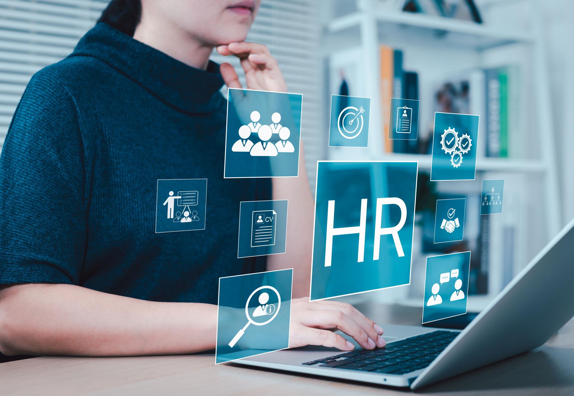 HR, HRM, Human resources management concept. Businesswoman works on laptop with HR icon representing human resource, recruitment, training, employee information, and checking resume of job applicants.